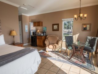 The Dunes Suite With King Bed, Love Seat, Dining Table And Coffee Station At Inn at Mavericks