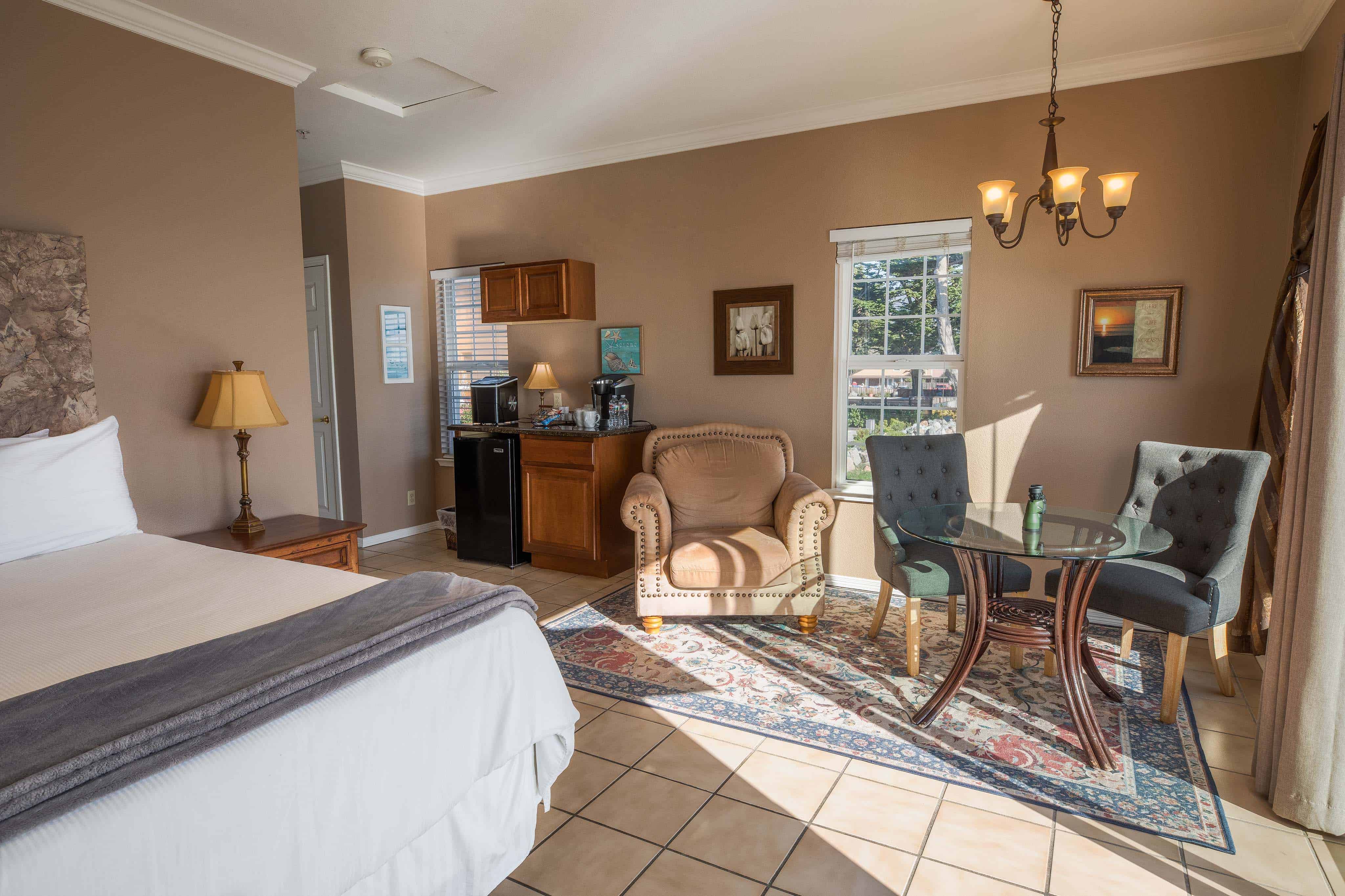 The Dunes Suite With King Bed, Love Seat, Dining Table And Coffee Station At Inn at Mavericks