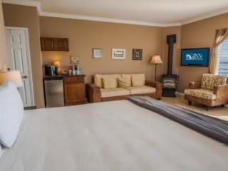 The Montara Suite With King Bed, Coffee Station, Sitting Area And Gas Stove At Inn at Mavericks