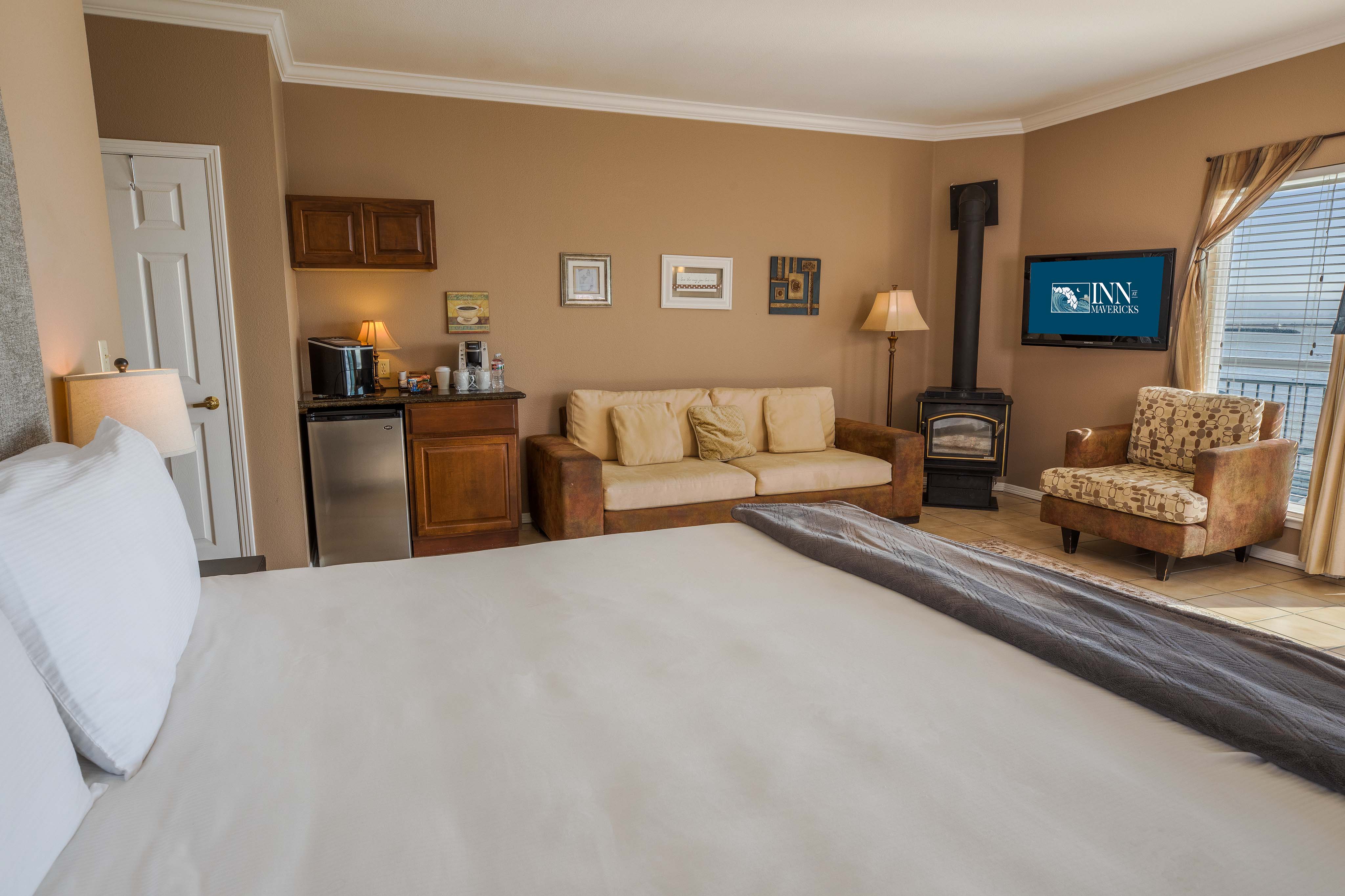 The Montara Suite With King Bed, Coffee Station, Sitting Area And Gas Stove At Inn at Mavericks