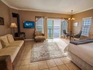 The Montara Suite With King Bed, Couch, Love Seat, Gas Stove And Dining Table At Inn at Mavericks